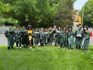 12 ACC (Arlington Tech) students and Ms. Monica pictured at the NVCC graduation