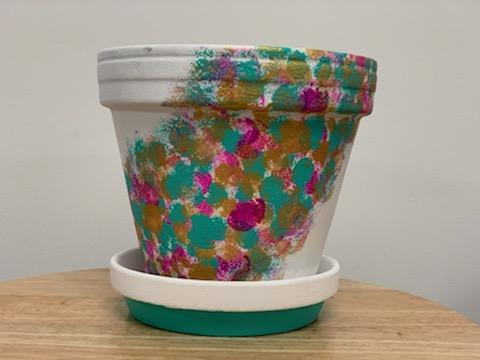 white flower pot with dots