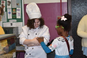 Chef Linguini introduces visitors to Remy the rat