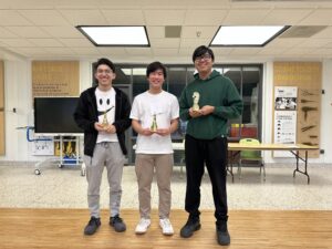 Three ACC students hold winning trophies