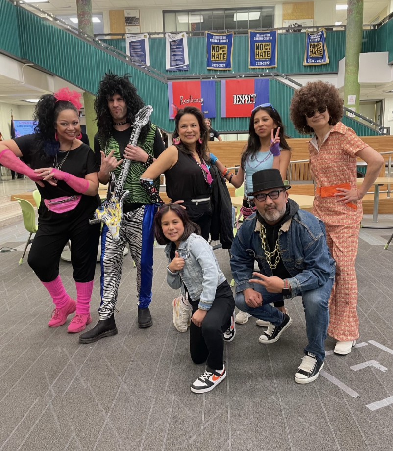 Picture of the staff and community members dressed for the Throwback Fashion show hosted by the ACC Academy and Cosmetology