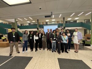 A group of standing attendees to the Career Center Law Conference 2025