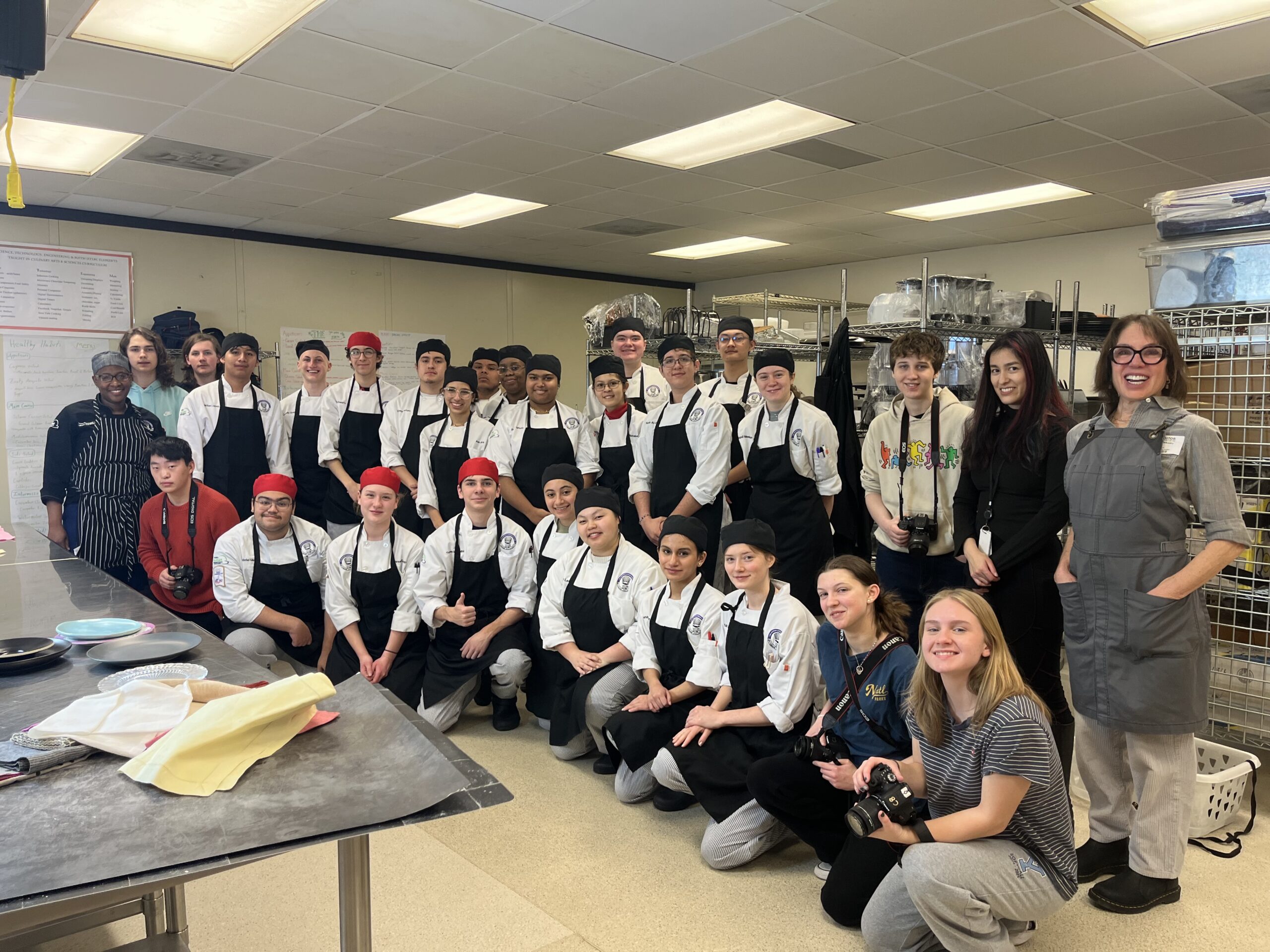 Culinary Arts and Digital photography students and instructors Chef Renee Randolph and Ms. Fae Montgomery pose with local food stylist and food photographer Lisa Cherkowski